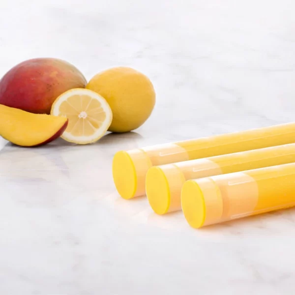 Aroma Sense Handheld cartridges with sliced mango in the background