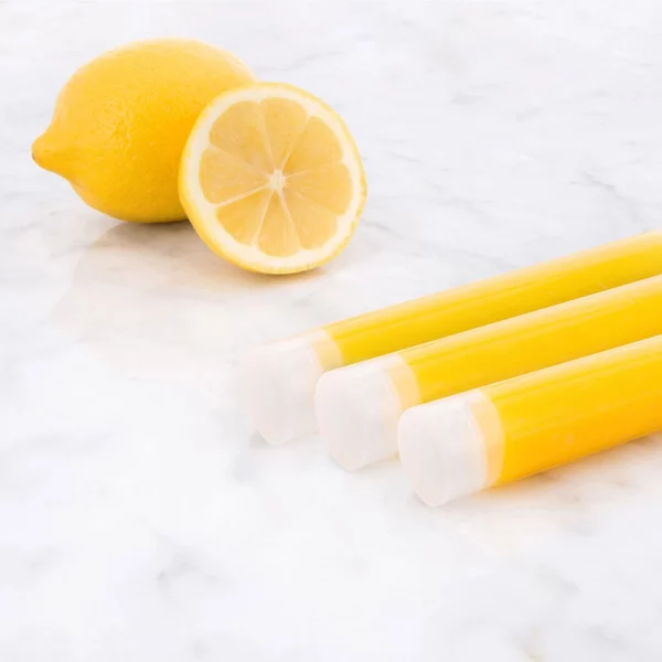 Aroma Sense Handheld cartridges with sliced lemon in the background