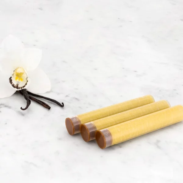 Aroma Sense Handheld cartridges with vanilla bean in the background